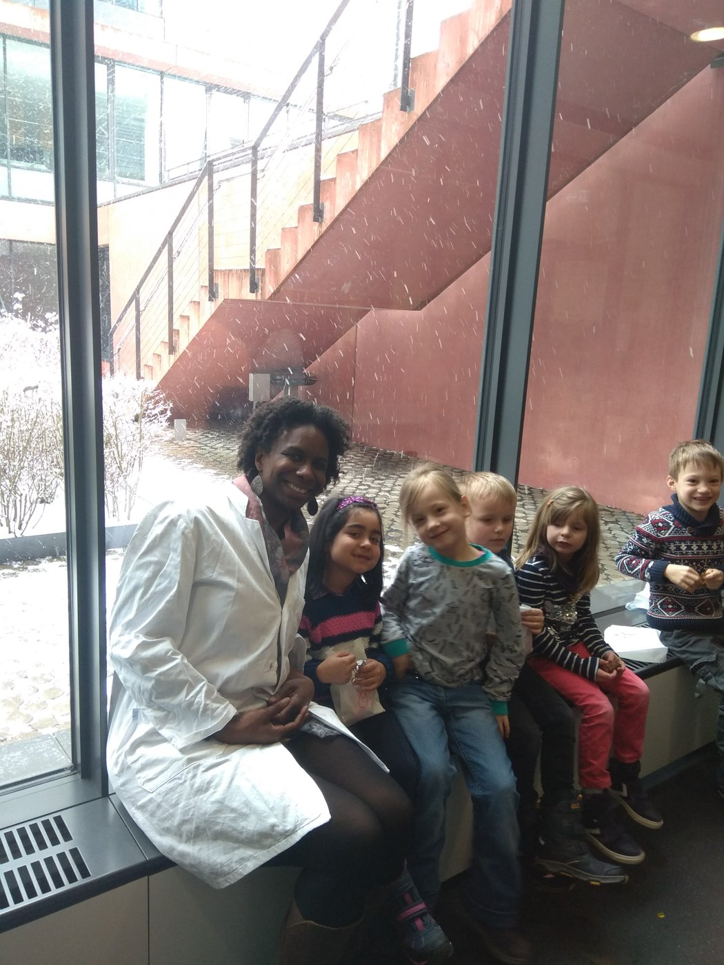 LaShae with a group of children at Kids Day